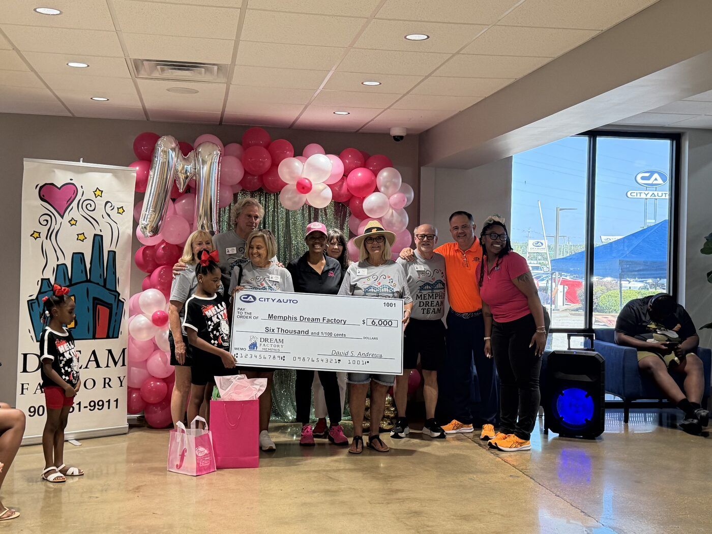 City Auto presenting a $6,000 check to the Memphis Dream Team